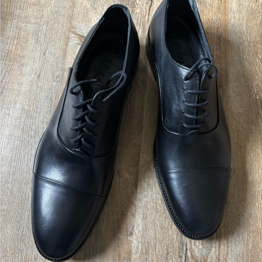 Black Oxford dress shoes with smooth leather and rounded toe
